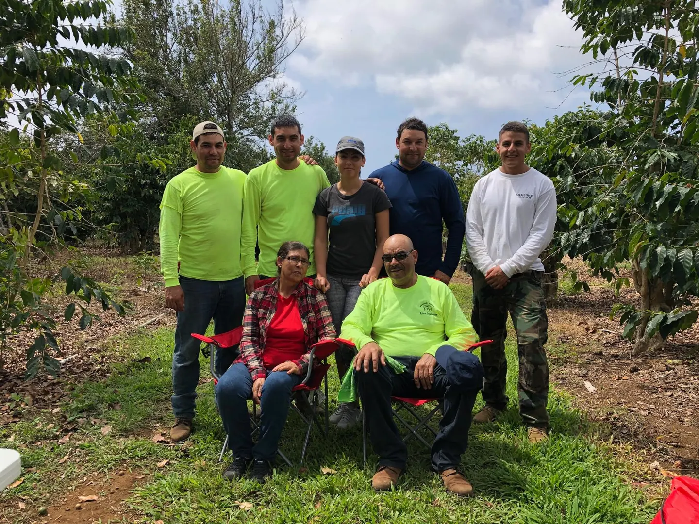 The Magaña family together in their Kona coffee field